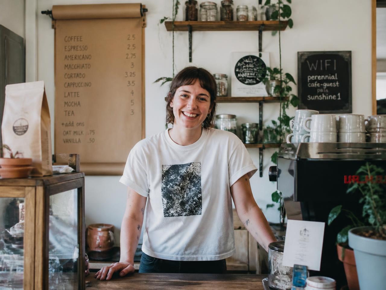 Local Asheville coffee shop owner behind the counter